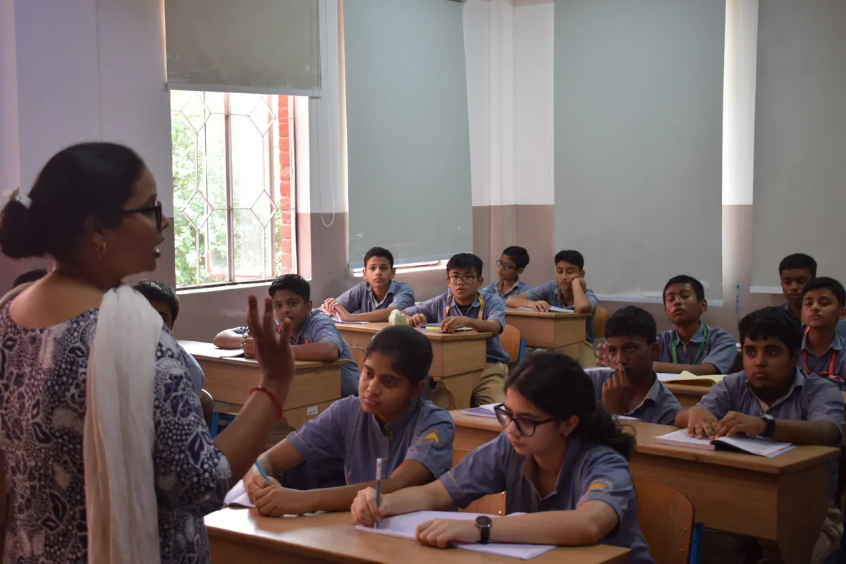 A teacher guiding students through an active-learning lesson