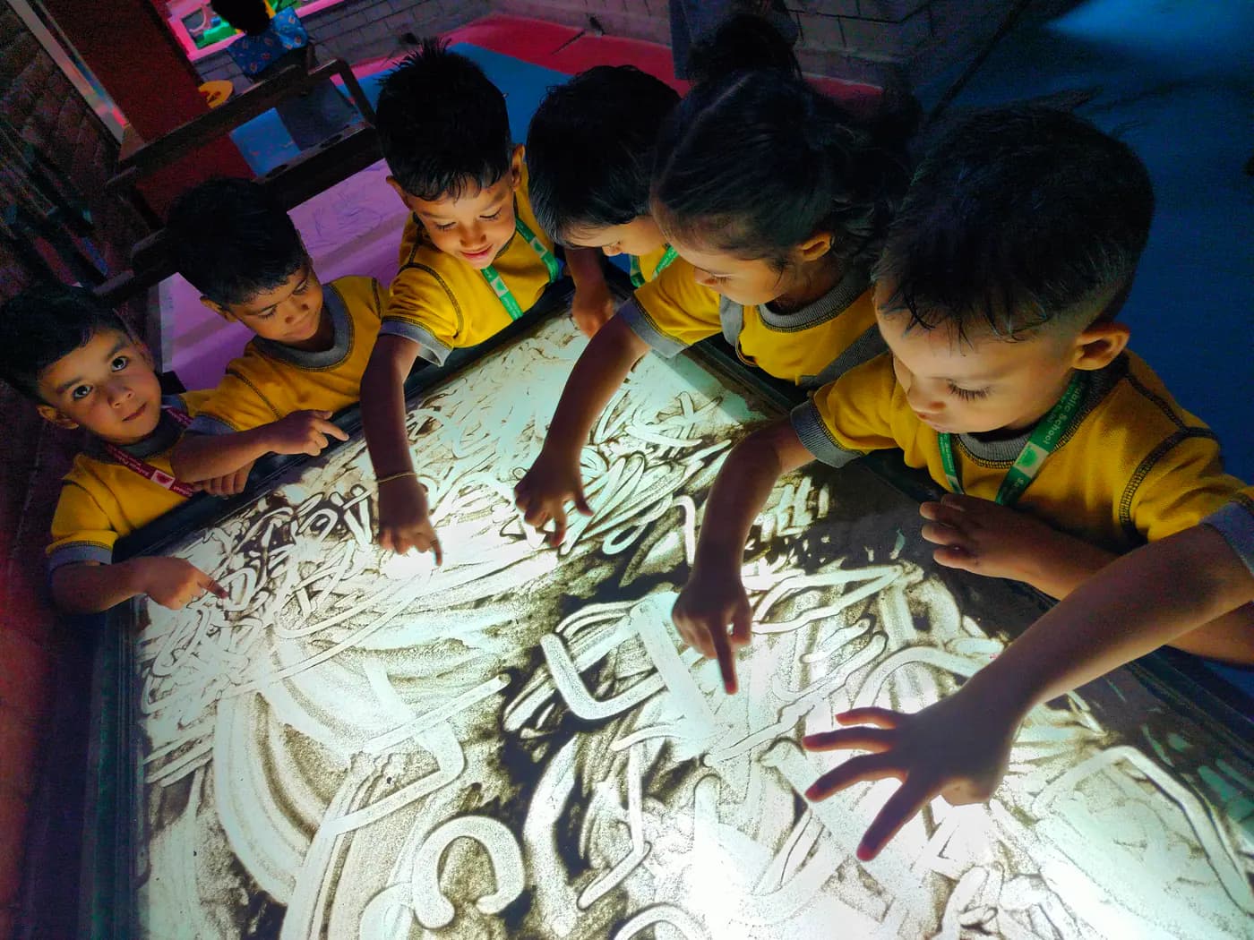 Young learners exploring a light table