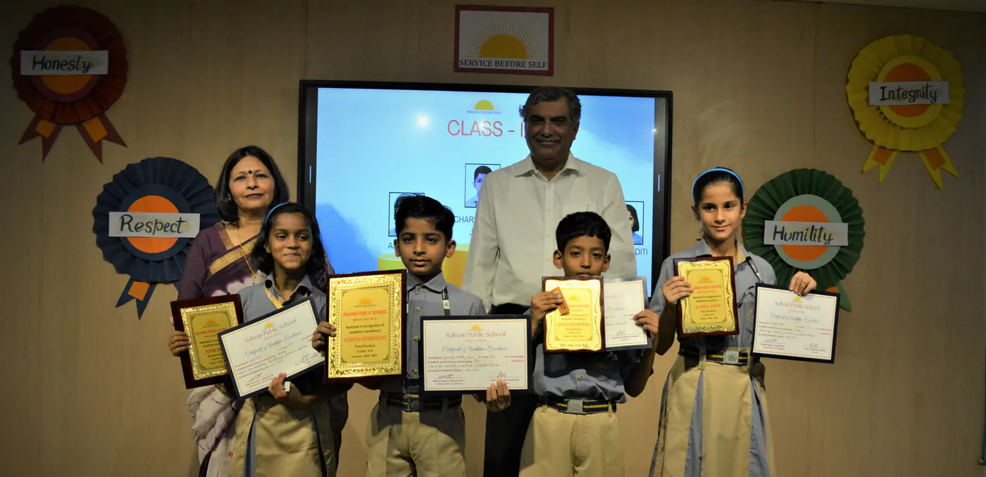 Students proudly displaying achievement certificates