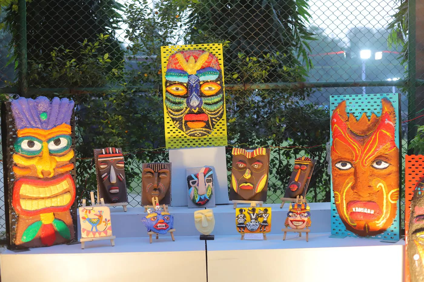 Colourful student-made masks at an art exhibition