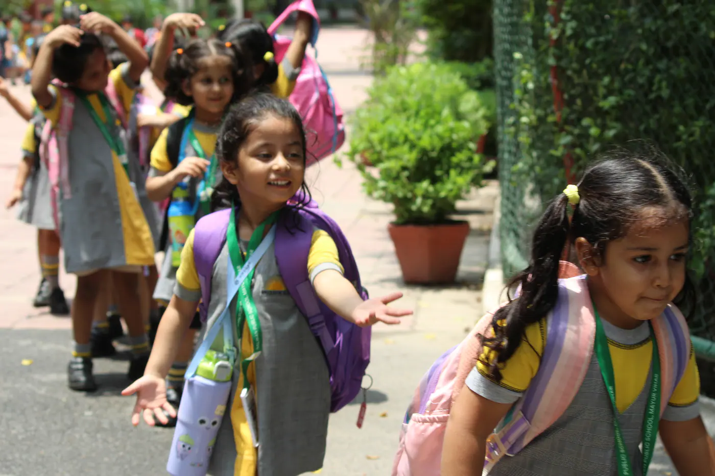 Young learners walking together on campus