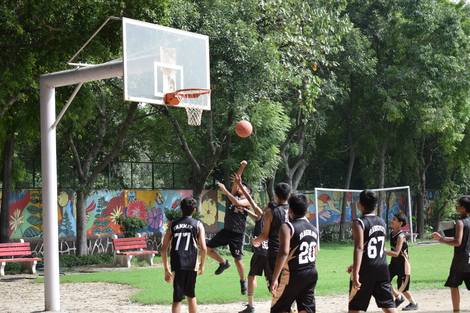 Salwan students playing basketball on campus