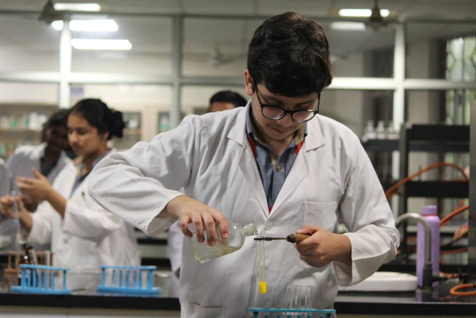 Chemistry laboratory with fume provision and reagent storage