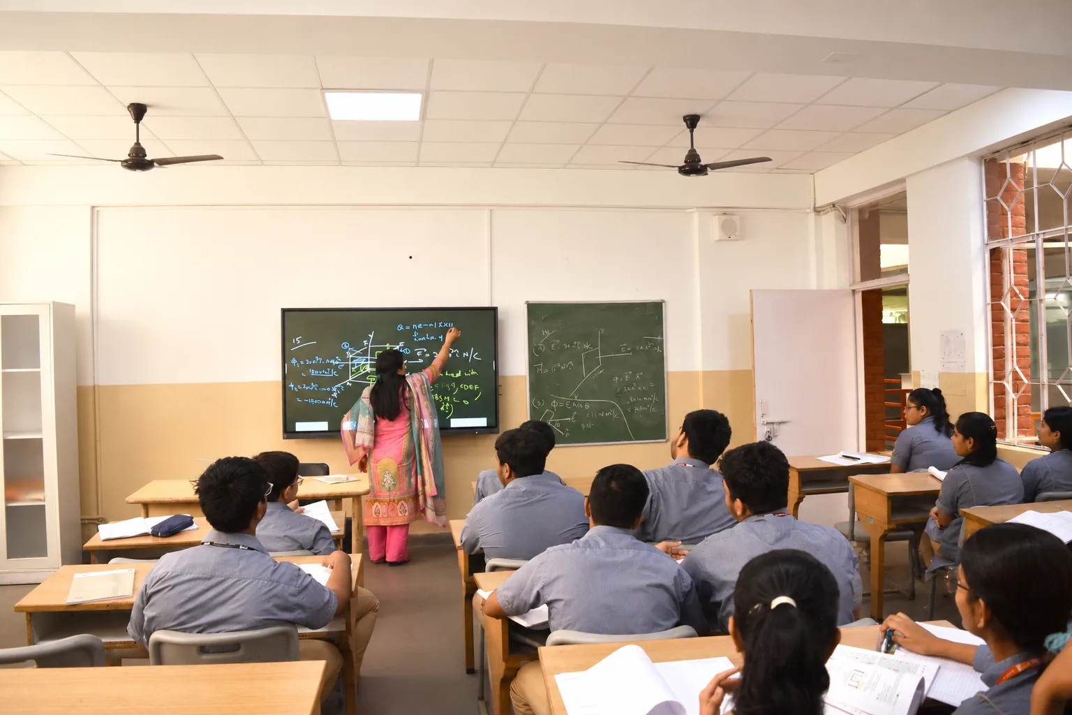 Airy, naturally lit classroom set up for group learning