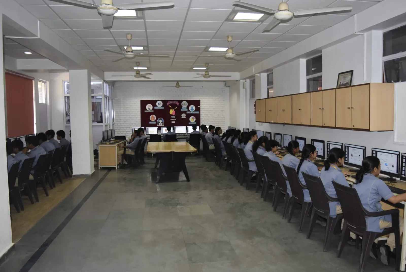 Computer laboratory with workstations for ICT lessons